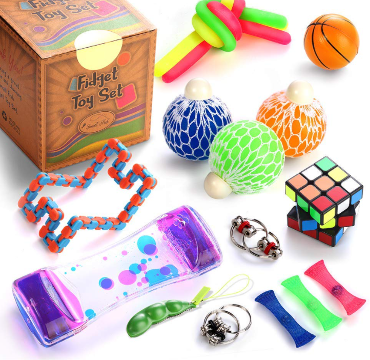 A scattering of various toys, including a Rubik's Cube and squishy balls, etc.